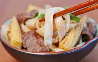 This is a low carb noodle dishes with slices of tender beef, baby corn, and diced green onions.