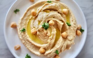 Hummus with chickpeas and parsley is an ideal snack for eating during World Cup since it has complex carbs and protein.